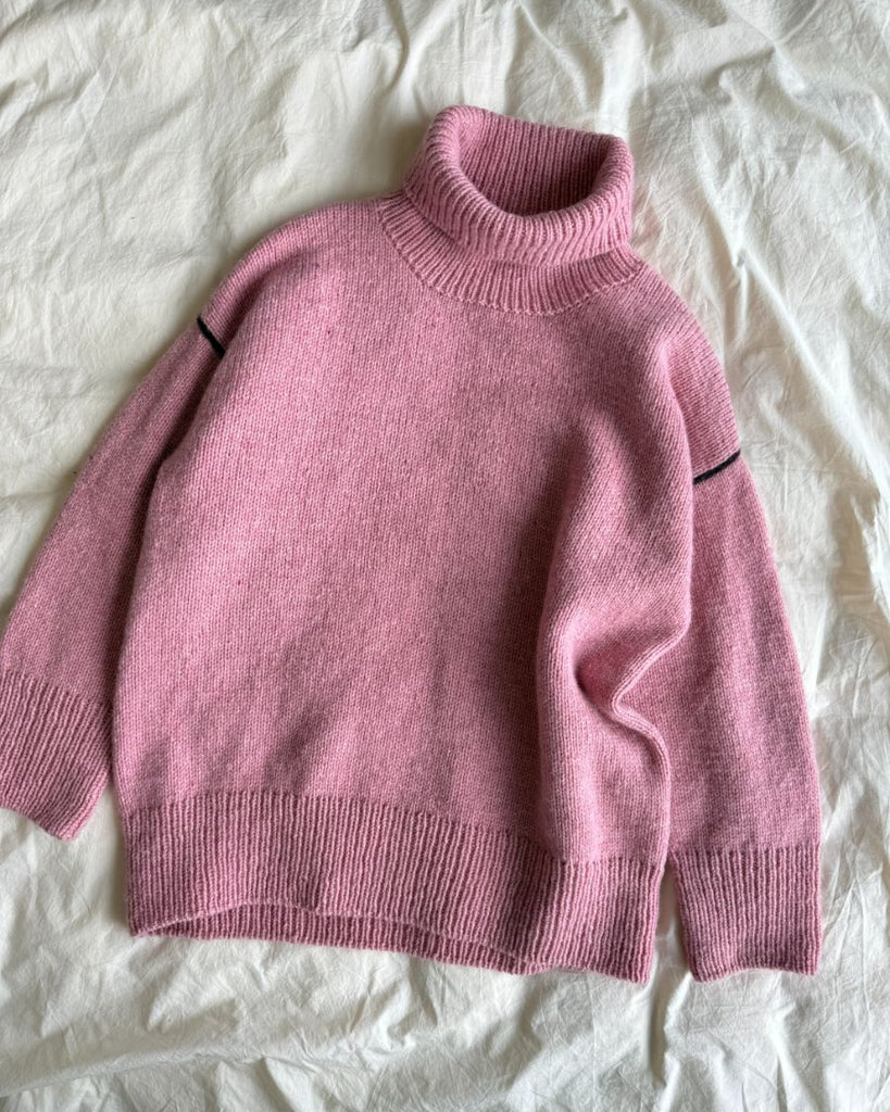 Lyserød Linea Sweater liggende