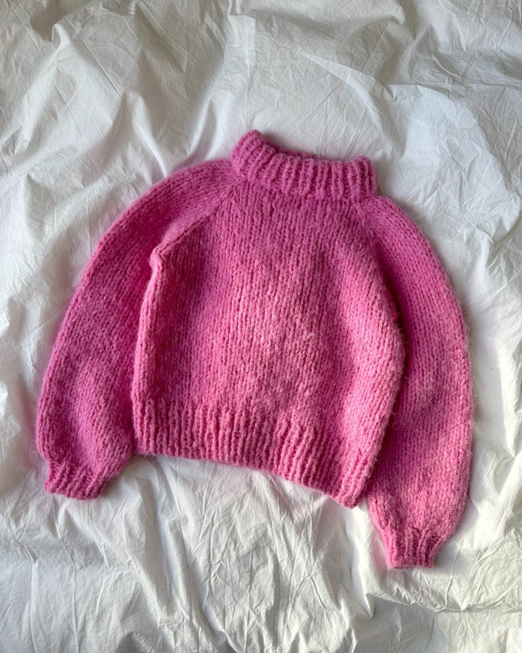 Barn iført pink Louisiana Sweater Junior