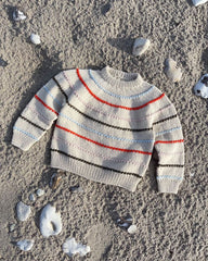 Liggende mangefarvet Festival Sweater