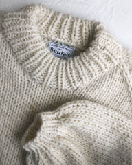 Closeup af hvid Holiday Sweater 