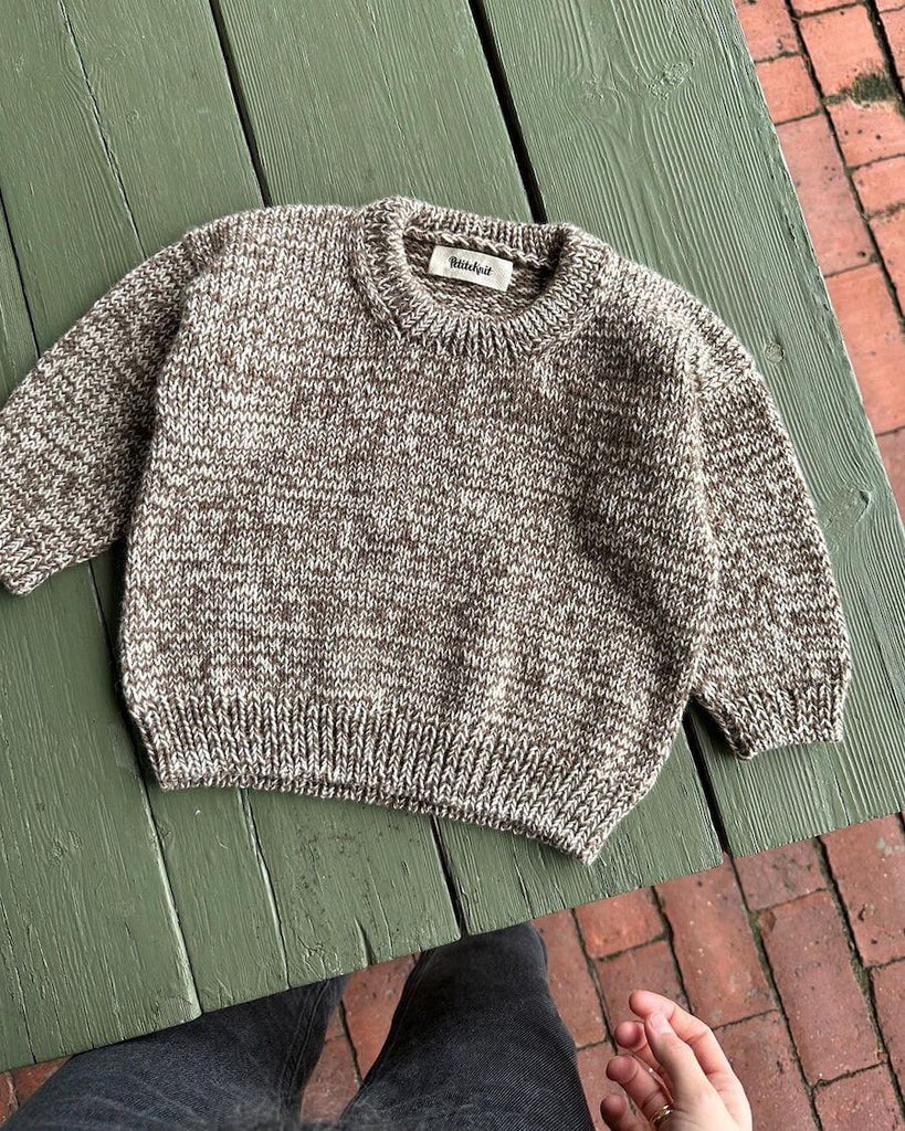 Liggebillede af lysebrun og hvid Melange Sweater Baby